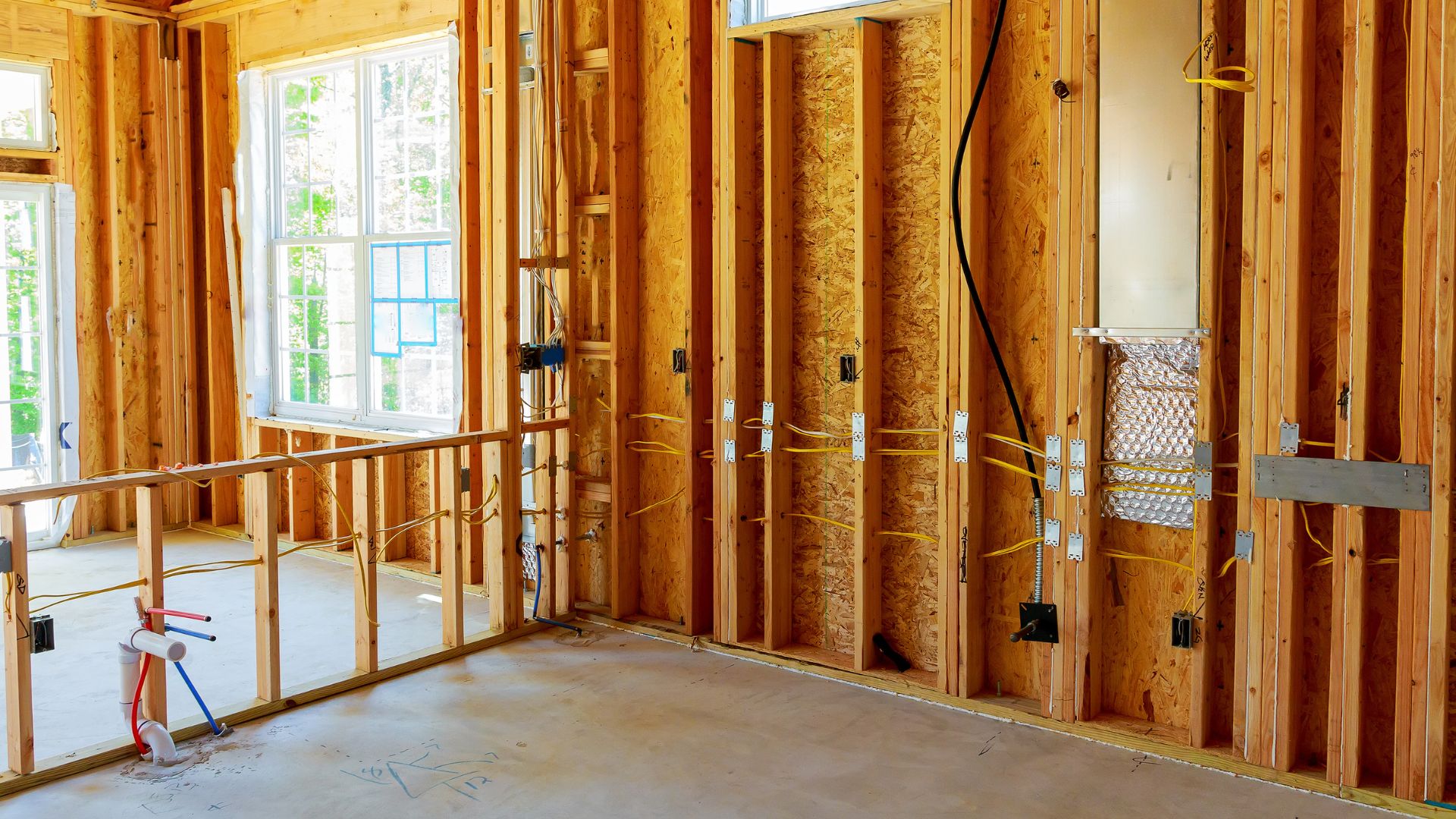 A house being built with a bicycle in the middle of the room